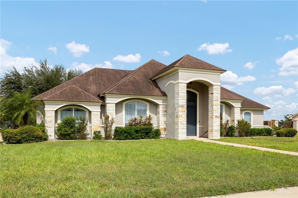 1236 Chloe Rae Circle Weslaco, TX 78599 - Photo 2 of 30 a front view of a house with garden