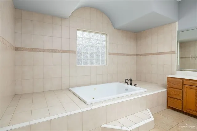 a view of a patio with a table chairs and garden