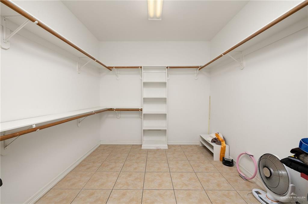 1236 Chloe Rae Circle Weslaco, TX 78599 - Photo 23 of 30 a view of storage and utility room with empty racks