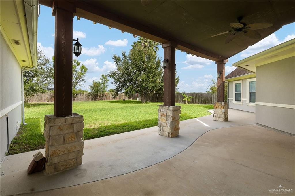 1236 Chloe Rae Circle Weslaco, TX 78599 - Photo 24 of 30 a view of a patio with a table chairs and garden