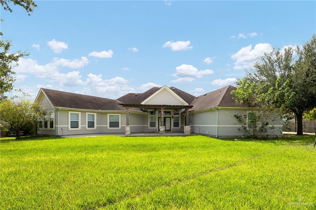 1236 Chloe Rae Circle Weslaco, TX 78599 - Photo 26 of 30 a view of a house with a yard and sitting area