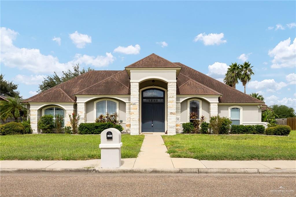 1236 Chloe Rae Circle Weslaco, TX 78599 - Photo 30 of 30 a front view of a house with a garden and plants