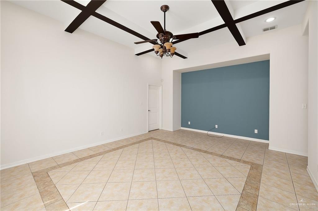 1236 Chloe Rae Circle Weslaco, TX 78599 - Photo 8 of 30 a view of a room with a ceiling fan and a window