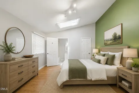 a bedroom with a bed and a dresser