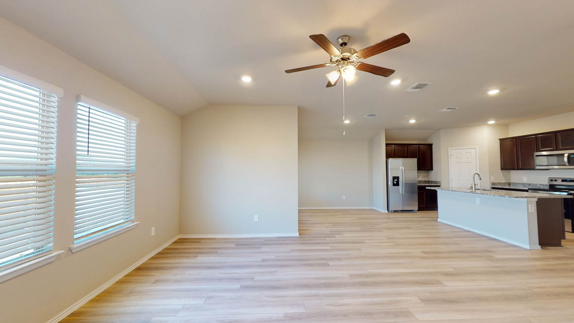 575 Hector Loop Georgetown, TX 78626 - Photo 9 of 28 Open-concept living area featuring wood-finish flooring, recessed lighting, and a ceiling fan