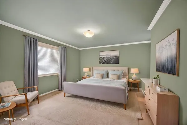 a bedroom with a bed and a couch
