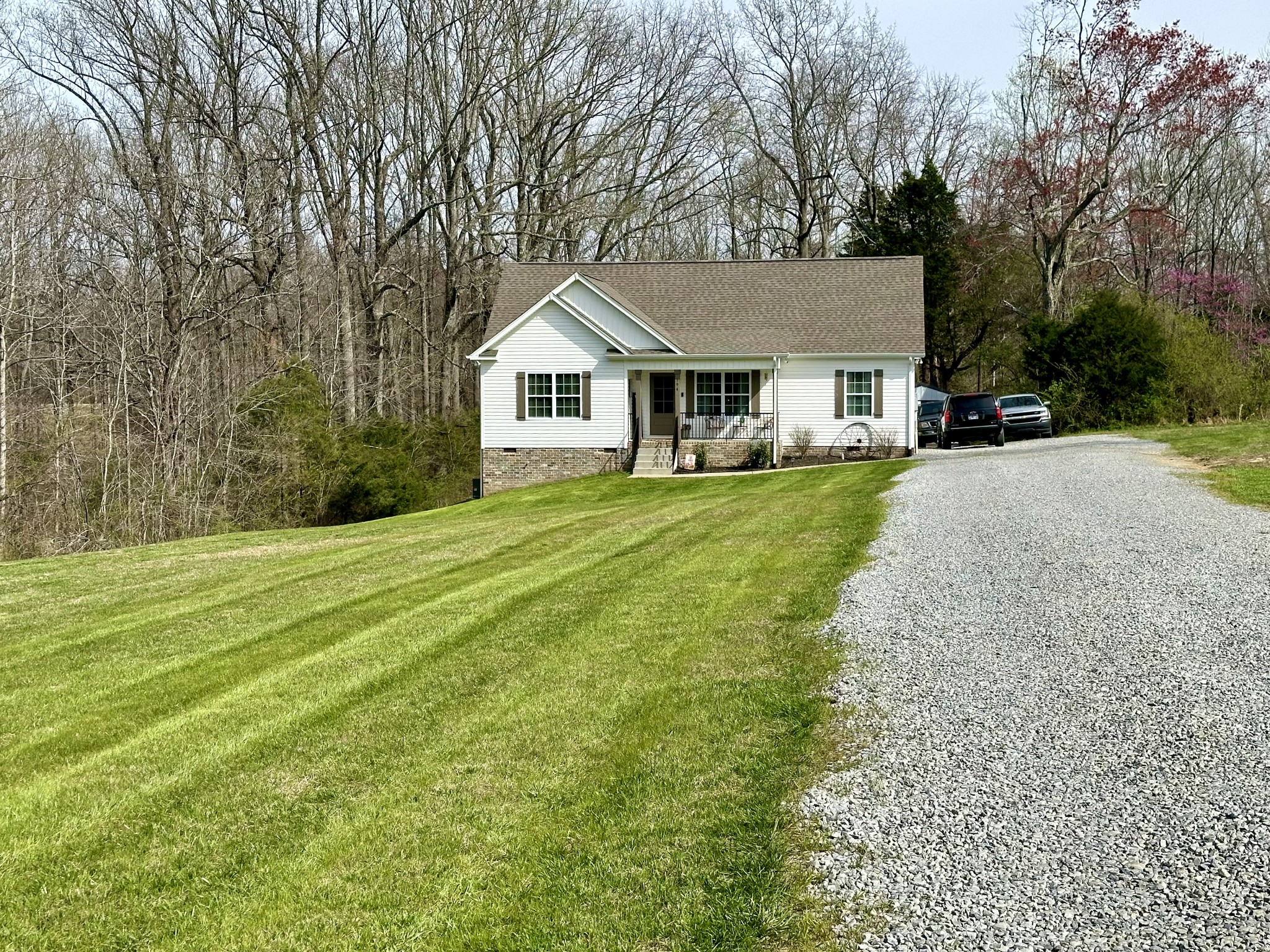 194 Mitchell Road Portland, TN 37148 - Photo 1 of 17 a front view of house with yard and trees