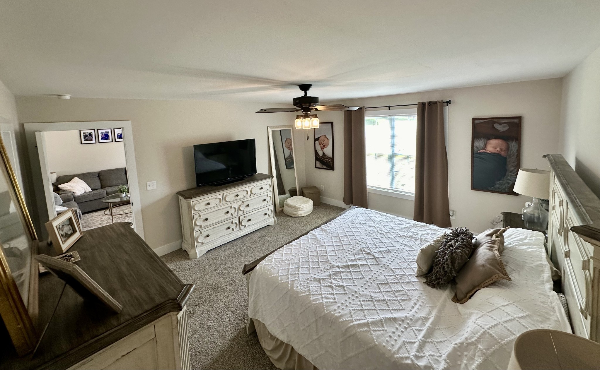 194 Mitchell Road Portland, TN 37148 - Photo 11 of 17 a bedroom with a bed and a flat tv screen on the dresser