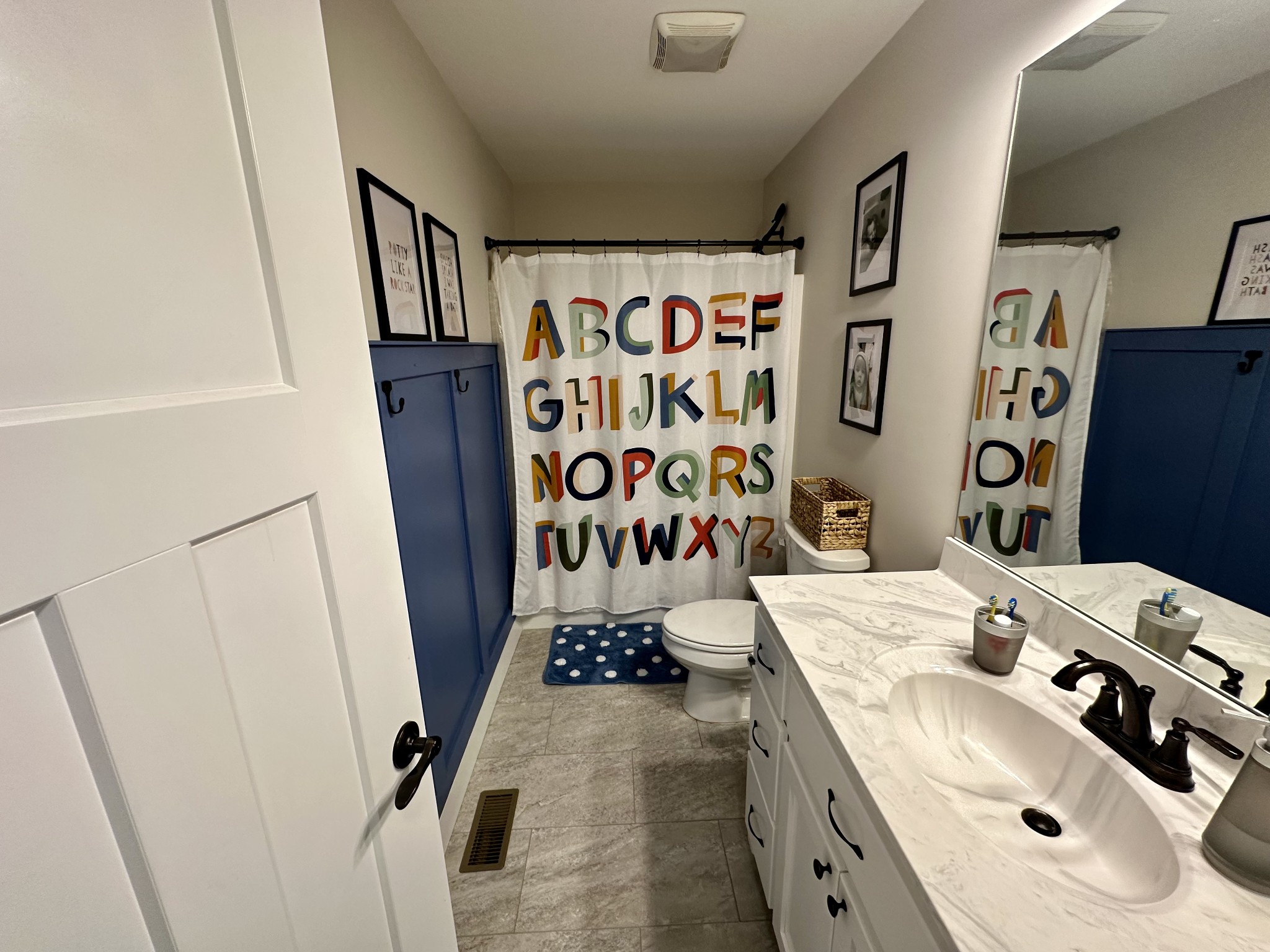 194 Mitchell Road Portland, TN 37148 - Photo 12 of 17 a bathroom with a sink and mirror with bathtub