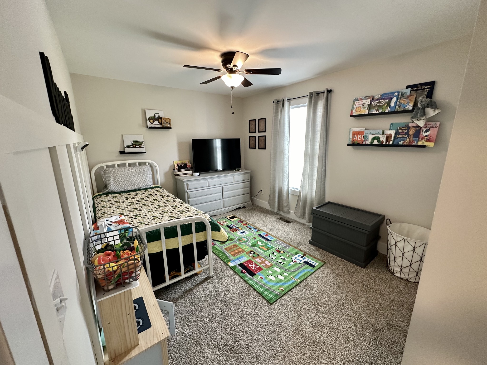 194 Mitchell Road Portland, TN 37148 - Photo 14 of 17 a bedroom with a bed and a flat screen tv