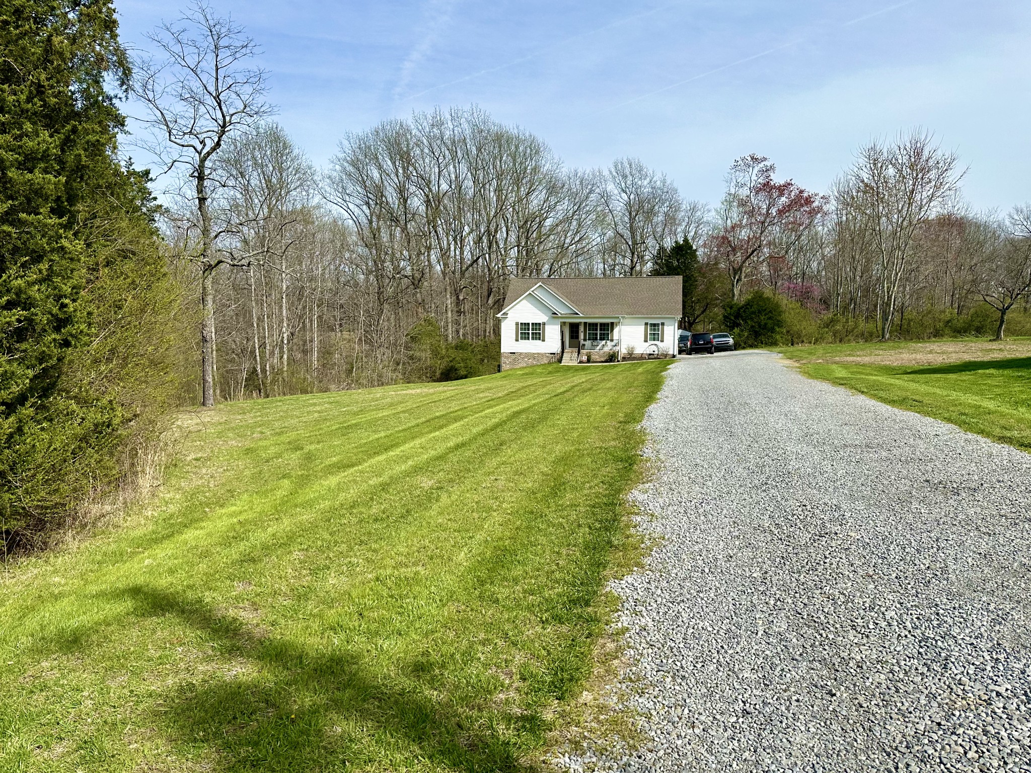194 Mitchell Road Portland, TN 37148 - Photo 17 of 17 a front view of a house with a yard and trees