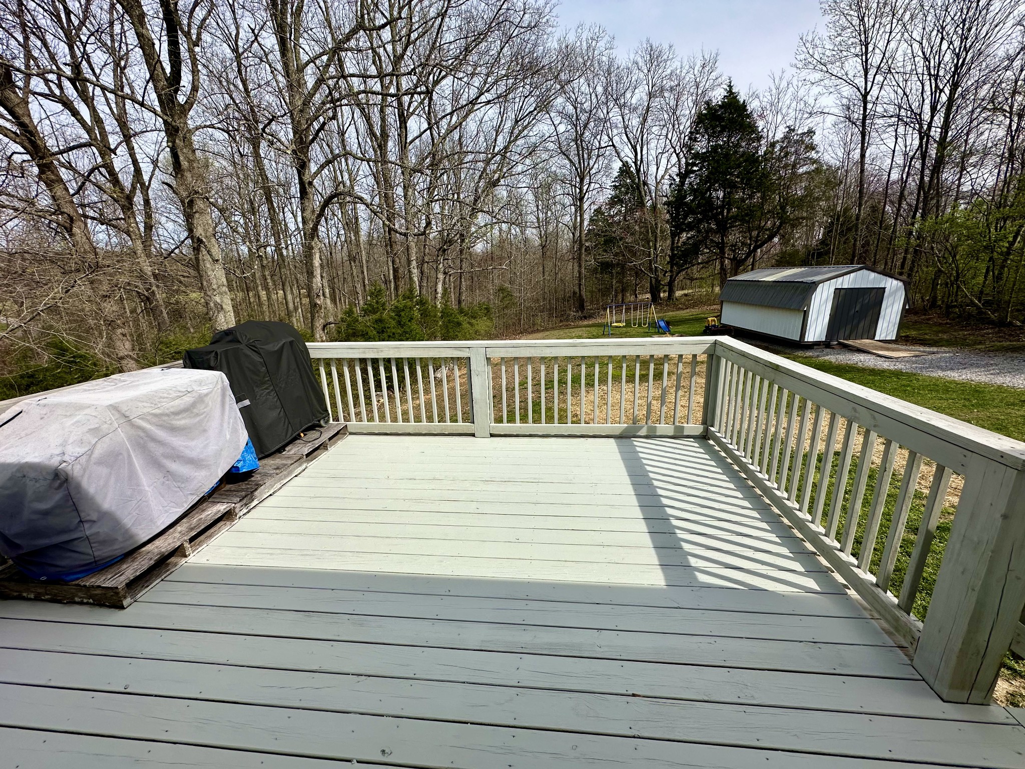194 Mitchell Road Portland, TN 37148 - Photo 7 of 17 a view of balcony with wooden floor and outdoor seating