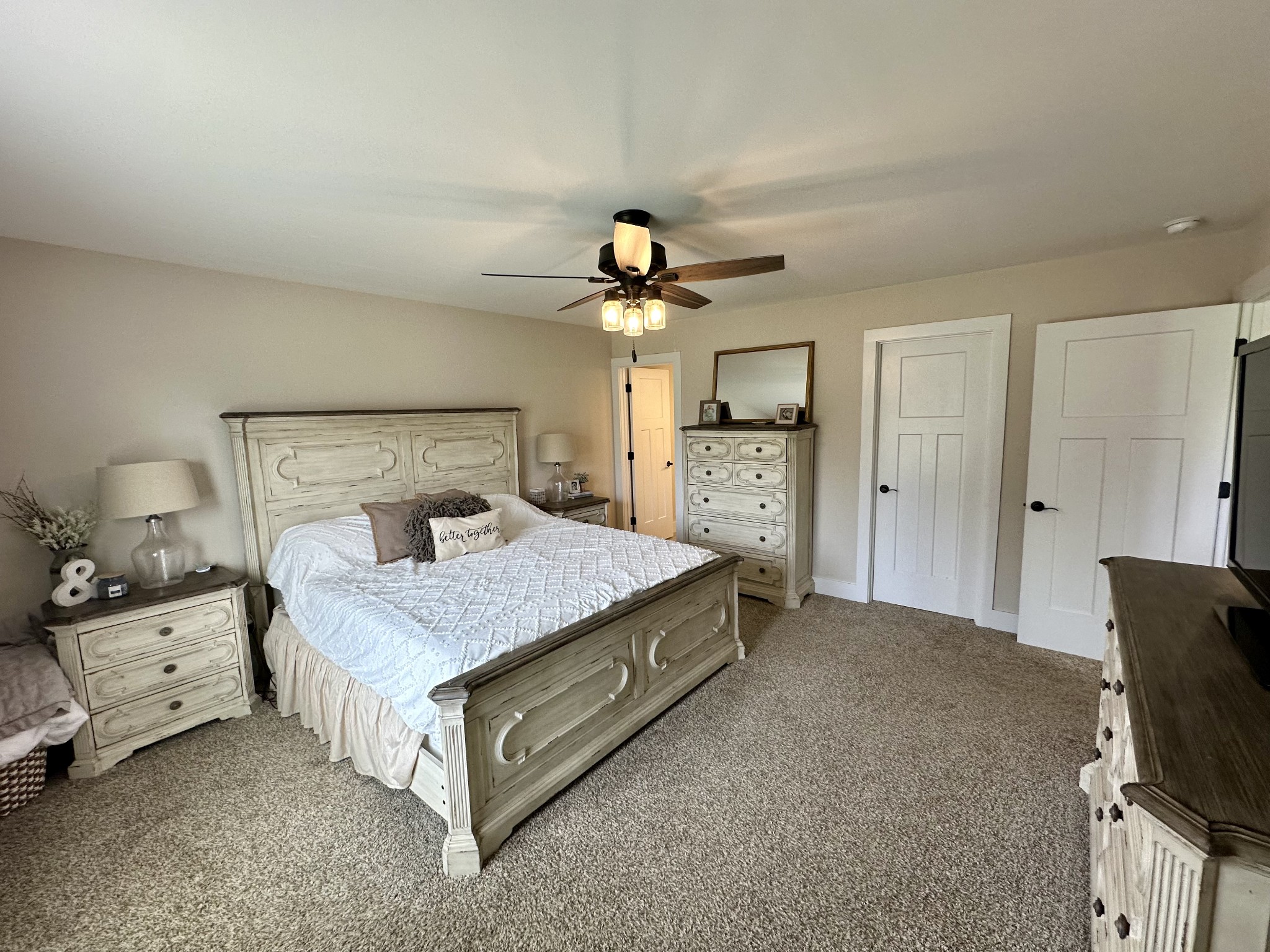 194 Mitchell Road Portland, TN 37148 - Photo 9 of 17 a bedroom with a bed and a chandelier