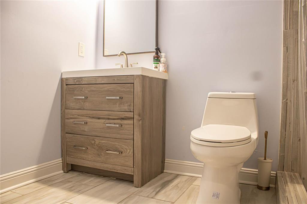 3281 Alhambra Circle Hampton, GA 30228 - Photo 61 of 88 a bathroom with a toilet and a sink