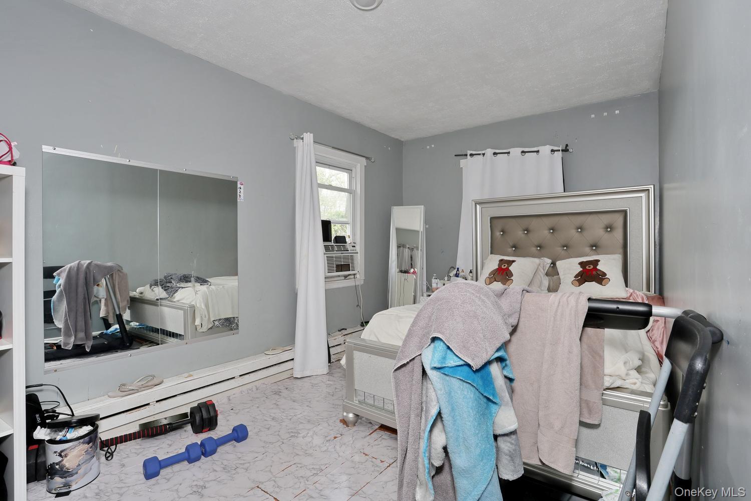 29 Fairview Avenue Spring Valley, NY 10977 - Photo 12 of 19 a living room with furniture and a mirror