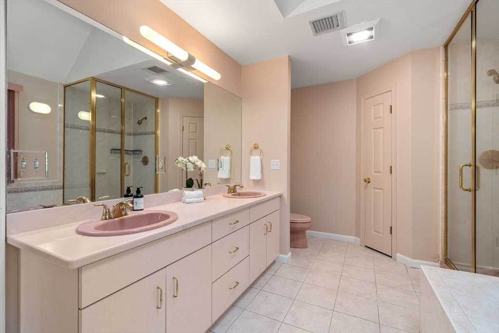 11 Black Elk Road Sharon, MA 02067 - Photo 25 of 28 a bathroom with a double vanity sink and a mirror