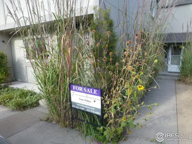 a sign that is on a brick wall