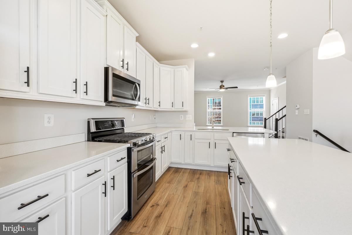 5820 Imperial Drive Frederick, MD 21703 - Photo 11 of 30 a kitchen with a sink a stove and cabinets