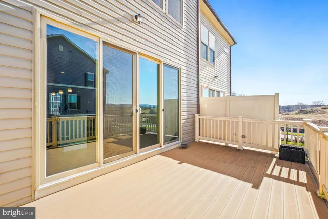 a view of a balcony with wooden floor
