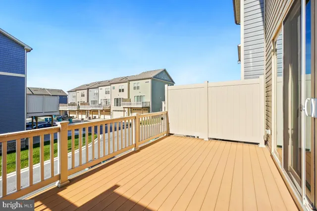 a view of a balcony with wooden floor