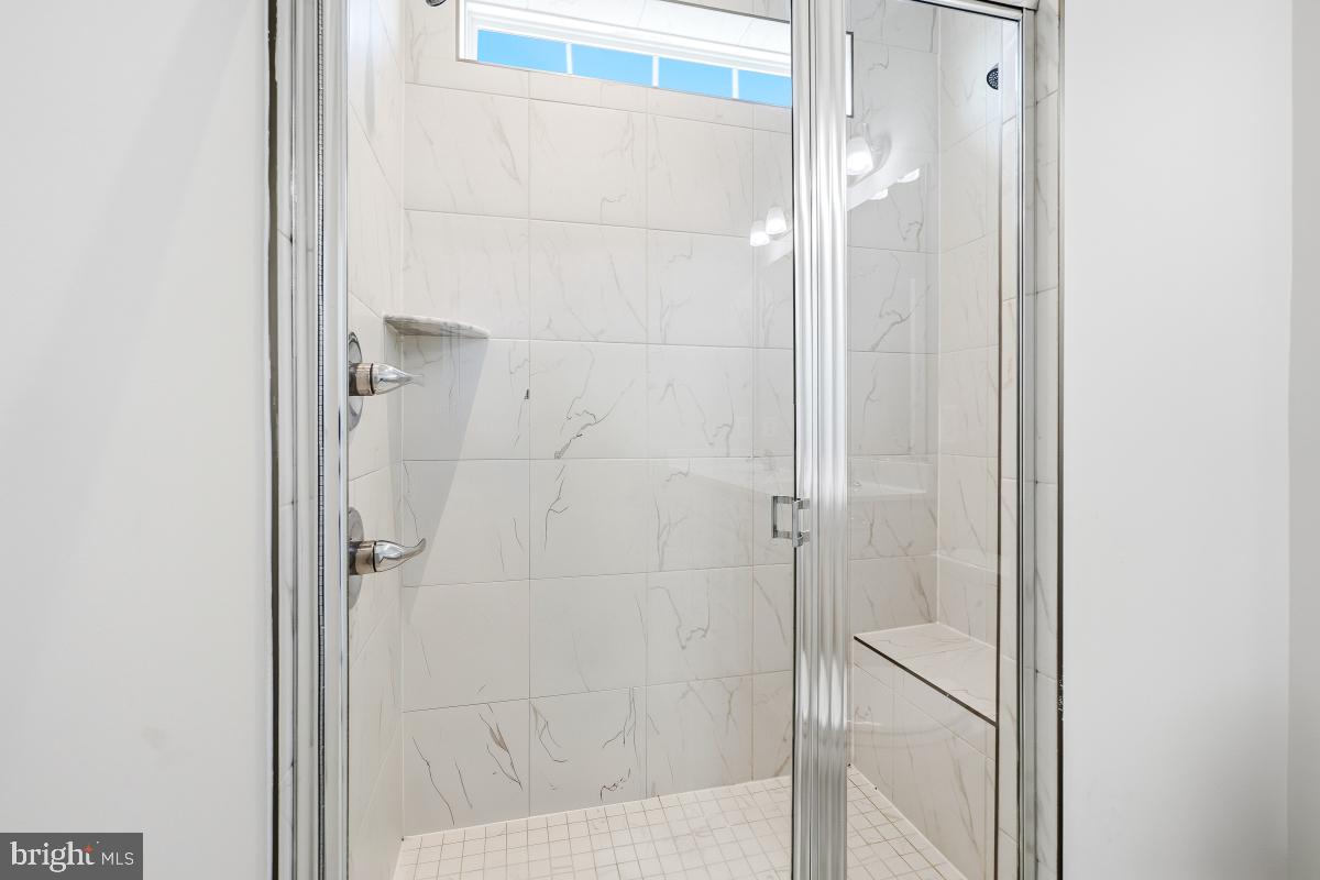 5820 Imperial Drive Frederick, MD 21703 - Photo 27 of 30 a bathroom with a glass shower door