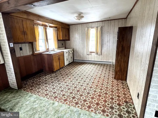 a bathroom with a sink a mirror and a shower