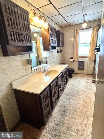 a bathroom with sink and mirror