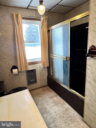 a kitchen with a refrigerator and a sink