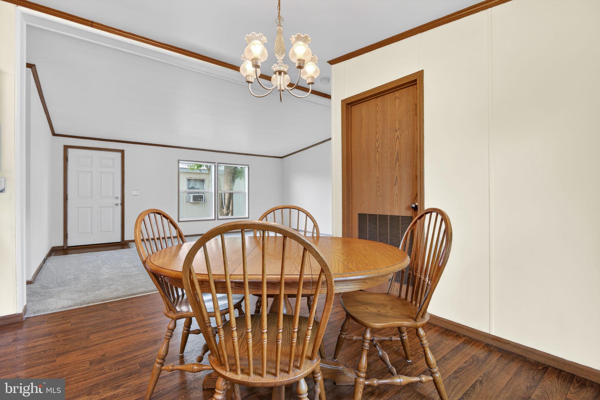 723 Sherry Lane Lancaster, PA 17601 - Photo 11 of 24 a view of a dining room with furniture and chandelier