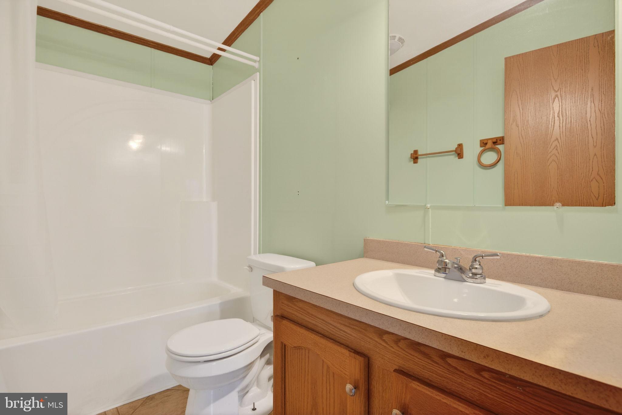 723 Sherry Lane Lancaster, PA 17601 - Photo 21 of 24 a bathroom with a sink and a mirror