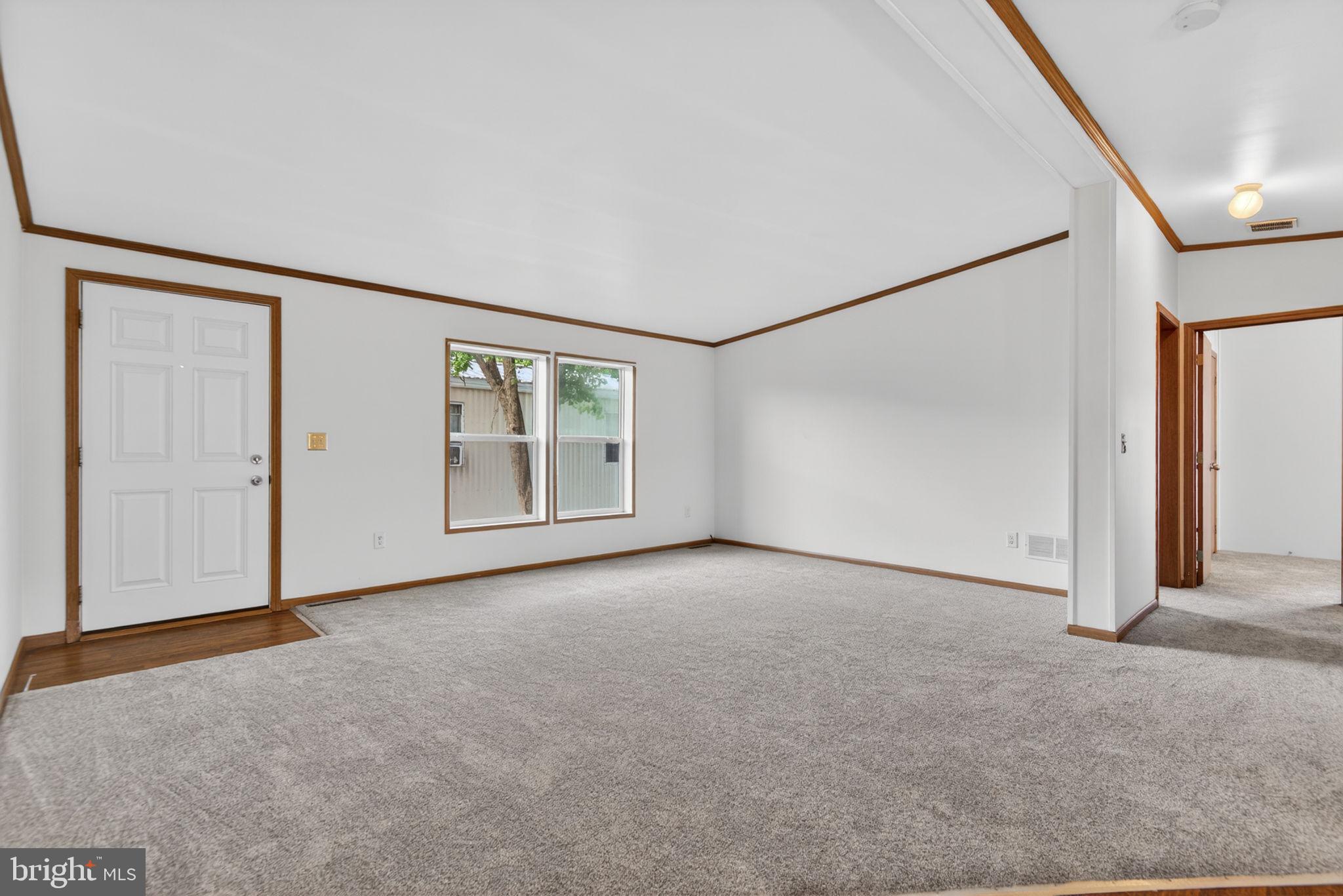 723 Sherry Lane Lancaster, PA 17601 - Photo 5 of 24 an empty room with windows and refrigerator