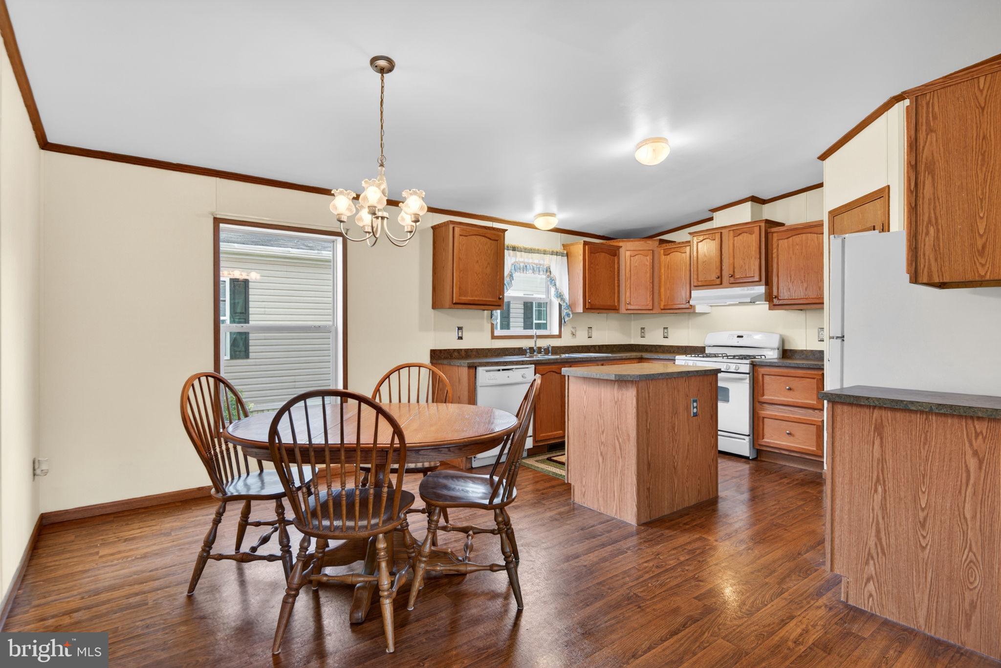 723 Sherry Lane Lancaster, PA 17601 - Photo 6 of 24 a view of a dining room with furniture window and wooden floor