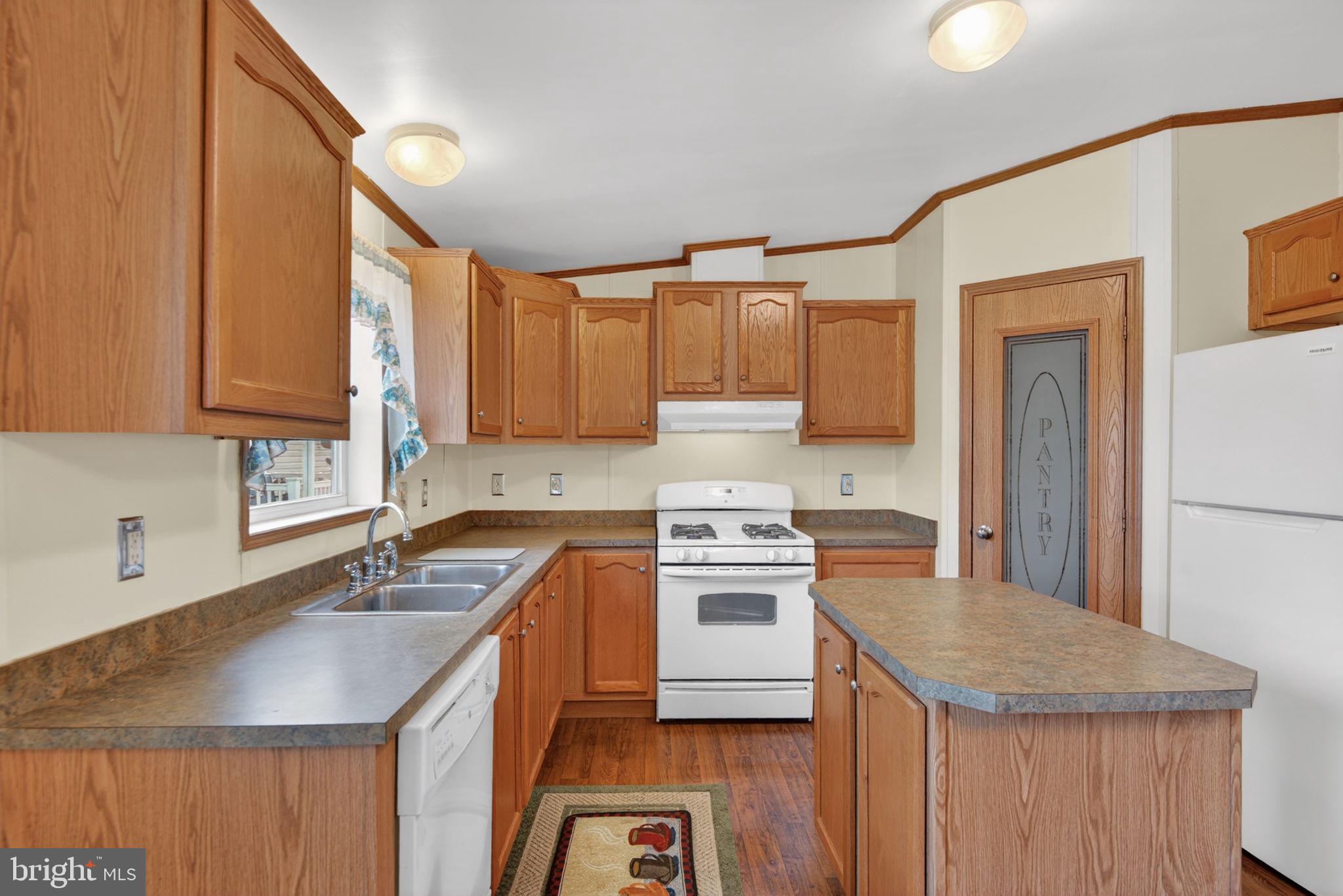 723 Sherry Lane Lancaster, PA 17601 - Photo 7 of 24 a kitchen with stainless steel appliances granite countertop a sink stove and refrigerator