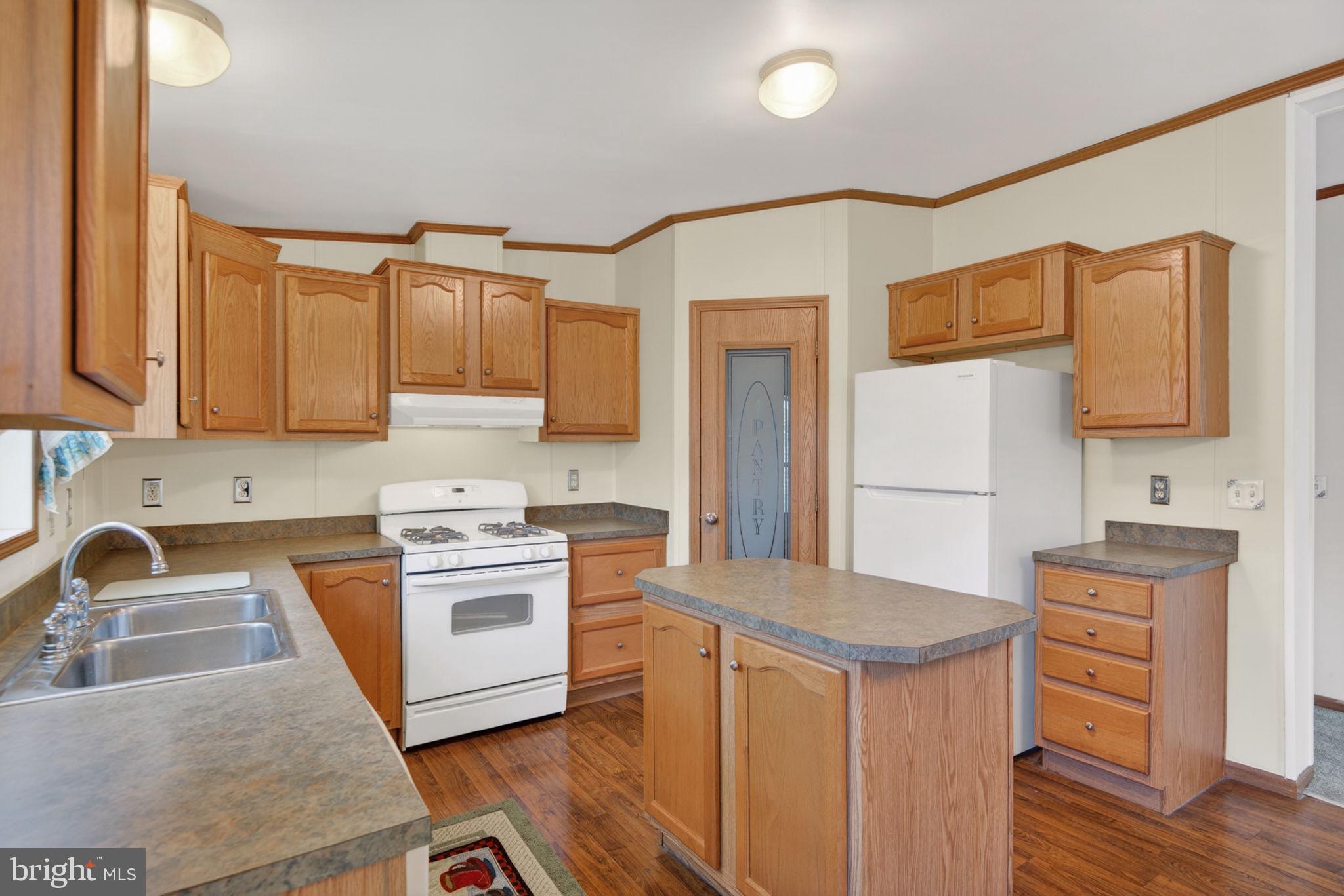 723 Sherry Lane Lancaster, PA 17601 - Photo 8 of 24 a kitchen with stainless steel appliances granite countertop a sink stove and refrigerator