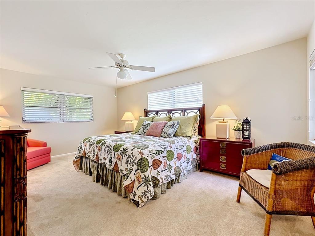 581 Yardarm Lane Longboat Key, FL 34228 - Photo 11 of 30 a bedroom with a bed and window