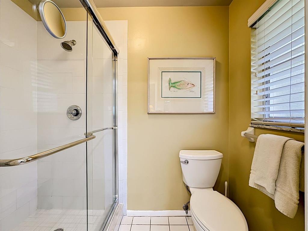 581 Yardarm Lane Longboat Key, FL 34228 - Photo 13 of 30 a bathroom with a toilet and a shower