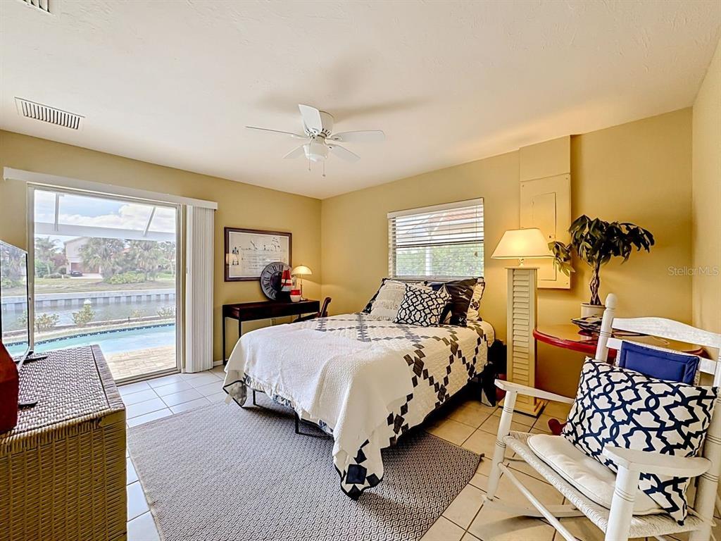 581 Yardarm Lane Longboat Key, FL 34228 - Photo 17 of 30 a bedroom with double bed and a window