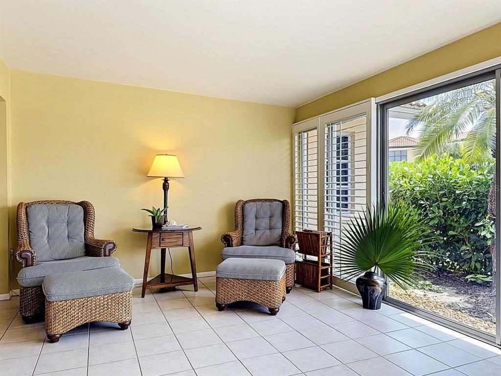 581 Yardarm Lane Longboat Key, FL 34228 - Photo 19 of 30 a living room with furniture and potted plants