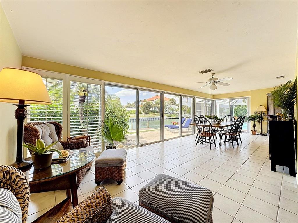 581 Yardarm Lane Longboat Key, FL 34228 - Photo 20 of 30 a living room with furniture and a large window