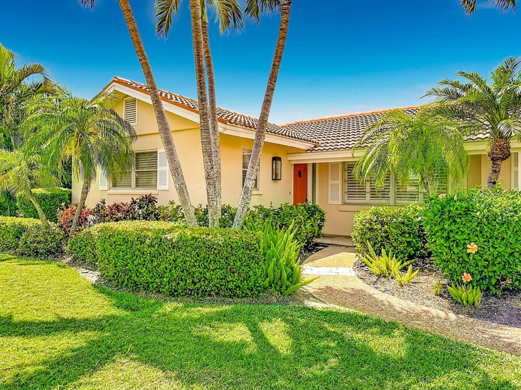 581 Yardarm Lane Longboat Key, FL 34228 - Photo 2 of 30 a front view of a house with garden