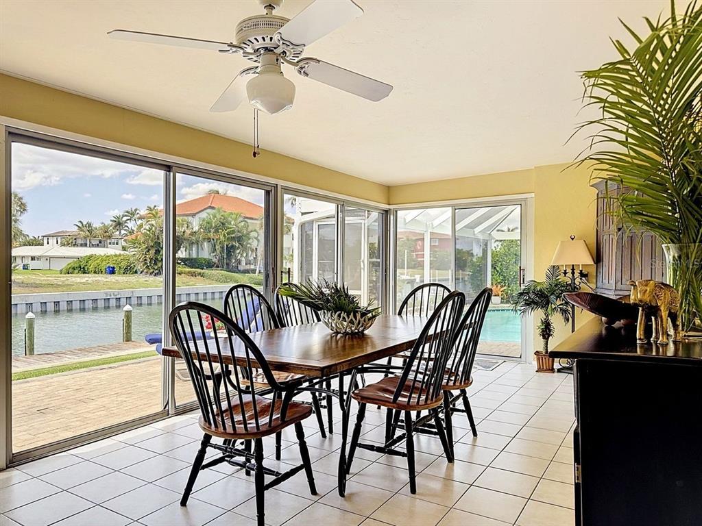 581 Yardarm Lane Longboat Key, FL 34228 - Photo 21 of 30 a view of a dining room with furniture window and outside view