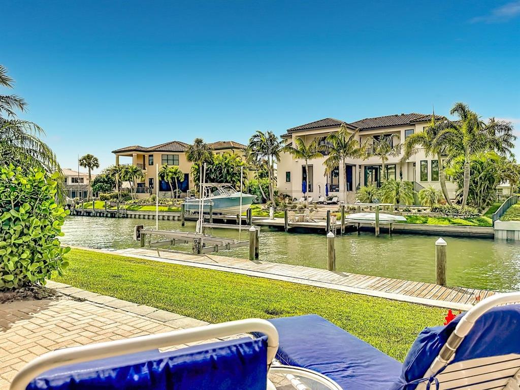 581 Yardarm Lane Longboat Key, FL 34228 - Photo 25 of 30 a view of swimming pool with outdoor seating and yard