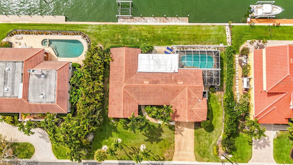 581 Yardarm Lane Longboat Key, FL 34228 - Photo 27 of 30 an aerial view of residential houses with outdoor space and swimming pool