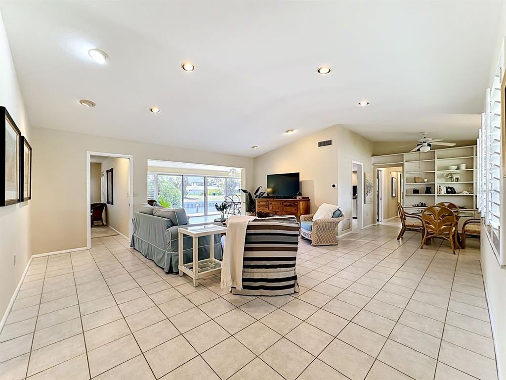 581 Yardarm Lane Longboat Key, FL 34228 - Photo 3 of 30 a living room with furniture and a flat screen tv