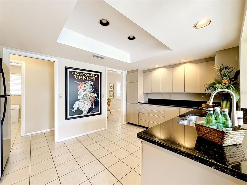 581 Yardarm Lane Longboat Key, FL 34228 - Photo 9 of 30 a kitchen with stainless steel appliances a sink and cabinets
