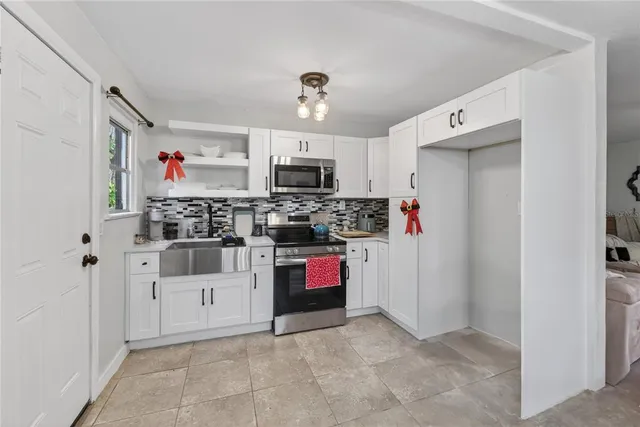 a bedroom with a bed and a mirror on a dresser