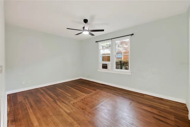 a view of a deck with table and chairs and wooden floor