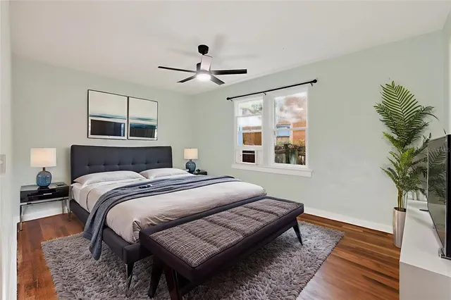 a view of a house with a patio and a yard