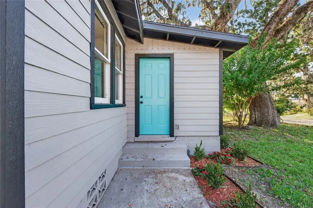 a kitchen with stainless steel appliances granite countertop a refrigerator sink and stove