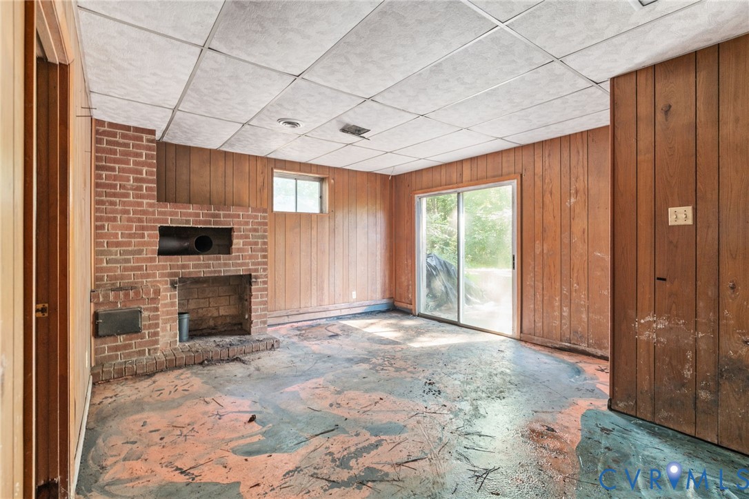3490 Willow Brook Road Bumpass, VA 23024 - Photo 39 of 47 a view of an empty room with a fireplace and a window